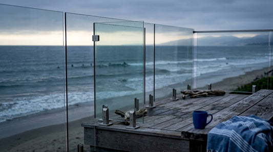 Coastal home balcony with glass railing and ocean view