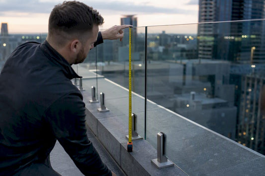 Measuring glass railing height on deck