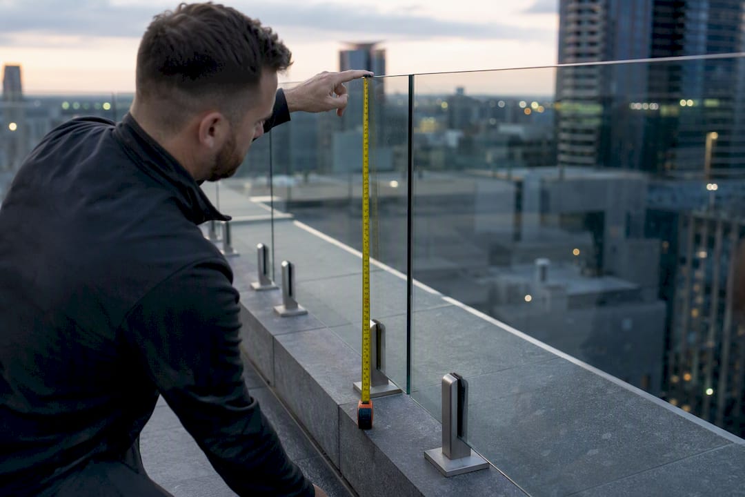 Measuring glass railing height on deck