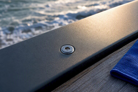 Coastal fastener beside coated aluminum edge
