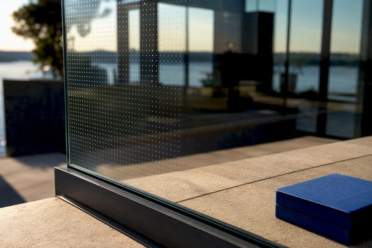 Patterned glass railing sample in daylight