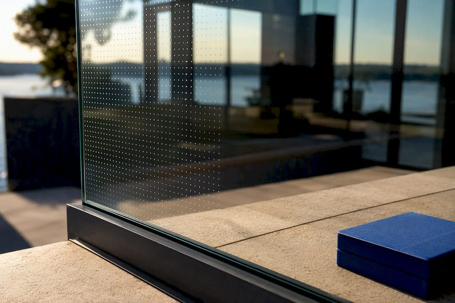 Patterned glass railing sample in daylight