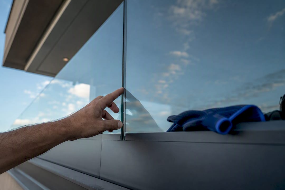 Close inspection of glass railing connection