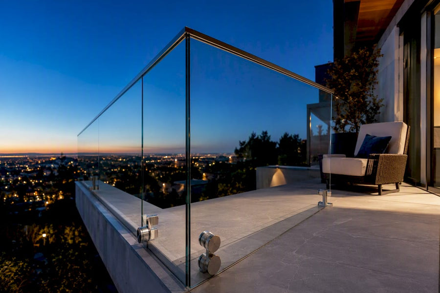 Glass balcony edge overlooking a modern home