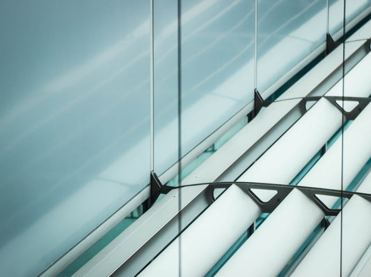 a close up of a window with a sky background - Photo by Sara Varasteh on Unsplash