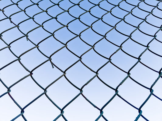 a close-up of a fence - Photo by Ethan Currier on Unsplash