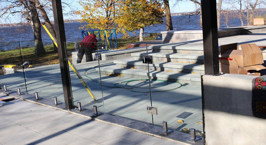 outdoor glass railing system under installation