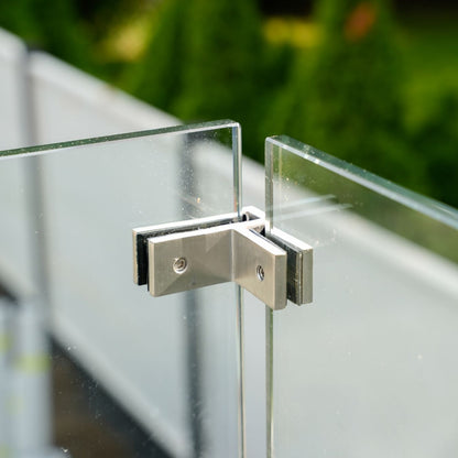 90 degree corner connector clamping two glass panels where a frameless railing turns