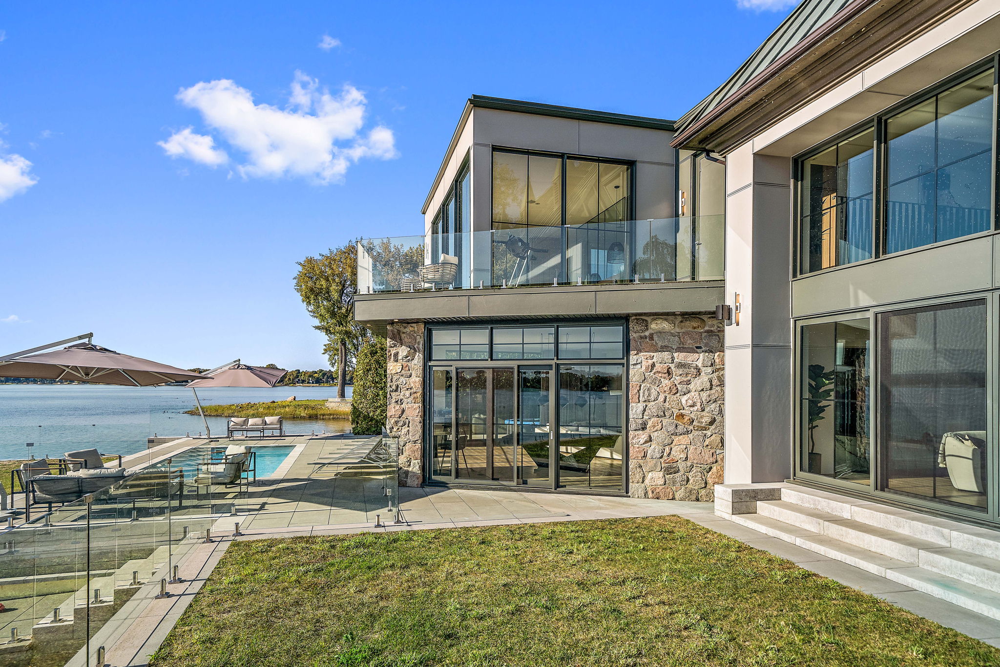 Modern house with a view of a lake on a clear day