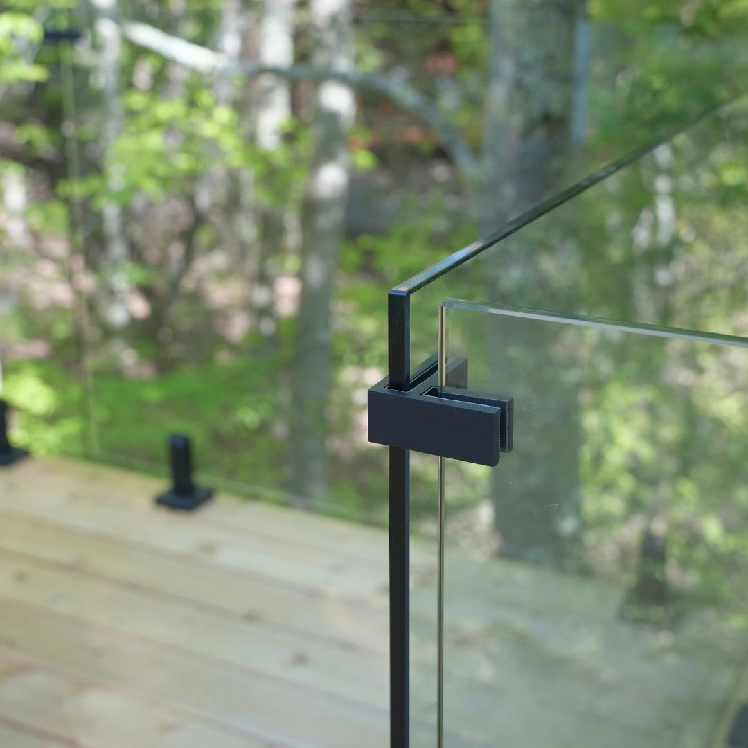 Glass railing corner connector joining two panels