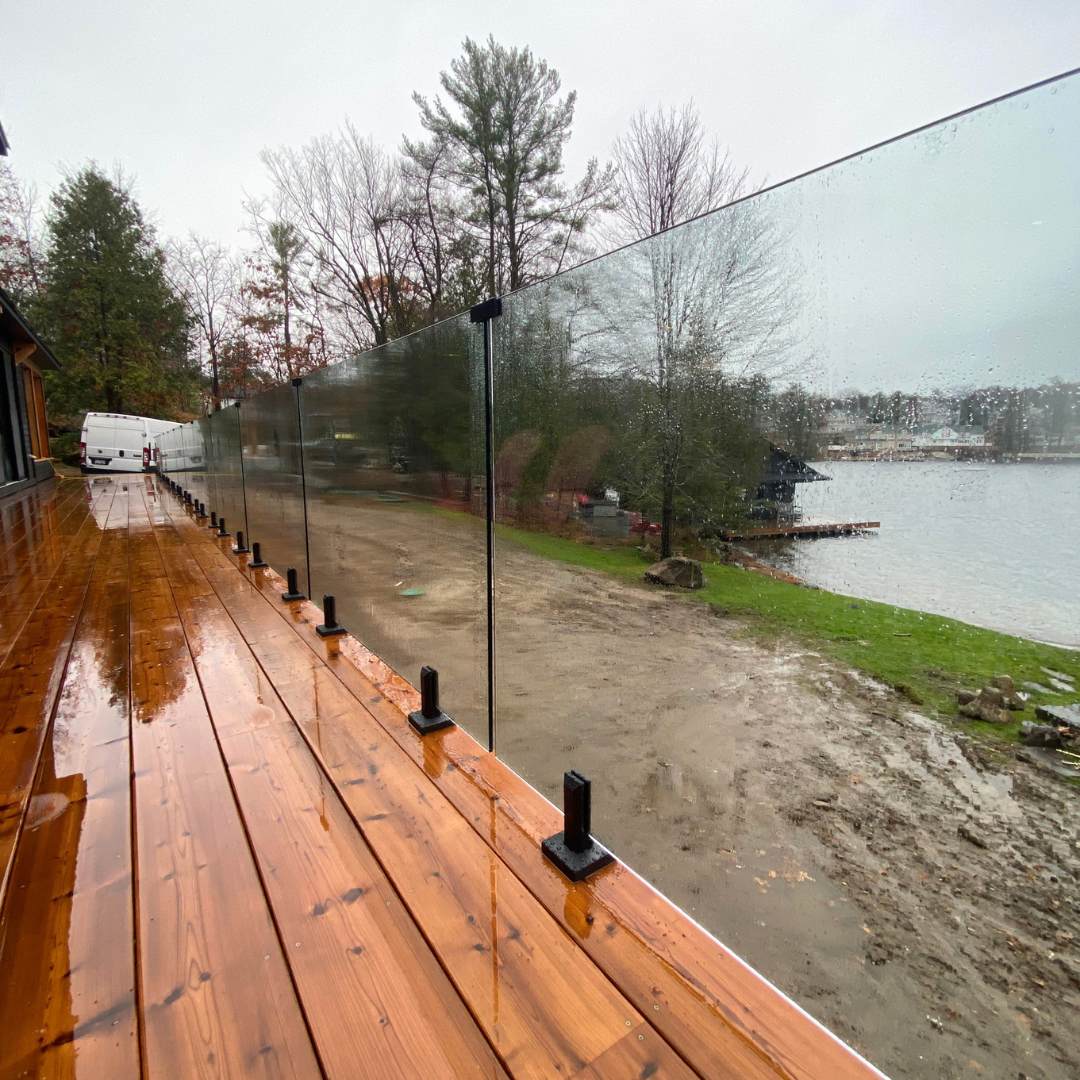 Tempered glass deck railing in a backyard patio