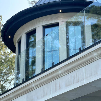 Glass balcony railing on a second-floor exterior