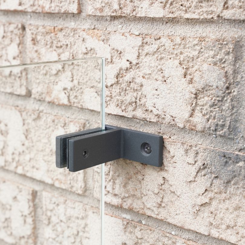 Matte black wall-to-glass connector for 12mm frameless glass railing, front view